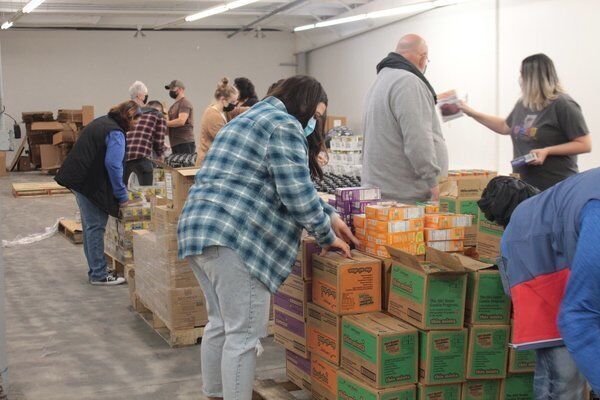 God's Pantry, volunteers pack 950 baskets for 'Sharing Thanksgiving' program