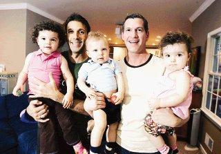 Gay couple welcome triplets after spending thousands on surrogacy