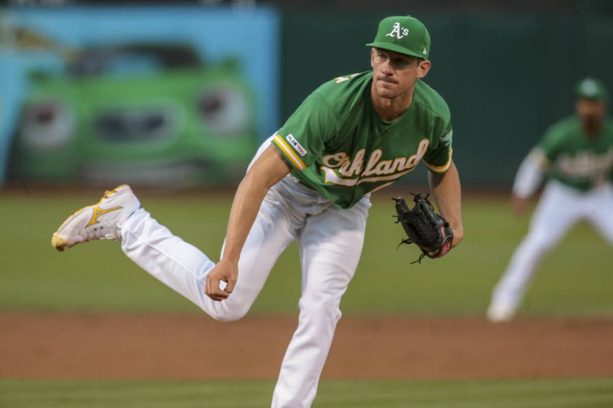 Chapman, Canha back Bassitt in A's 8-4 win over Astros