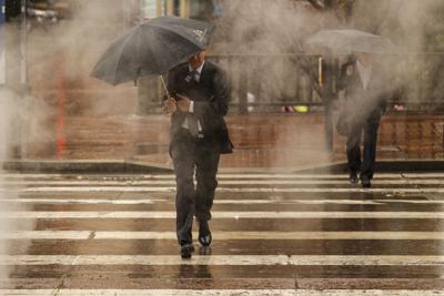 San Francisco pedestrians walk in rain
