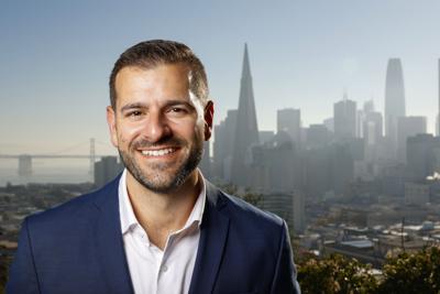 Danny Sauter, Supervisor-Elect for District 3 with a view of the city skyline