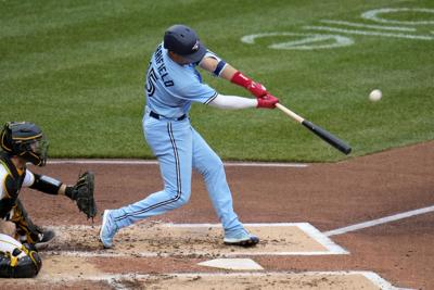 Toronto Blue Jays' Whit Merrifield runs to first base for a single