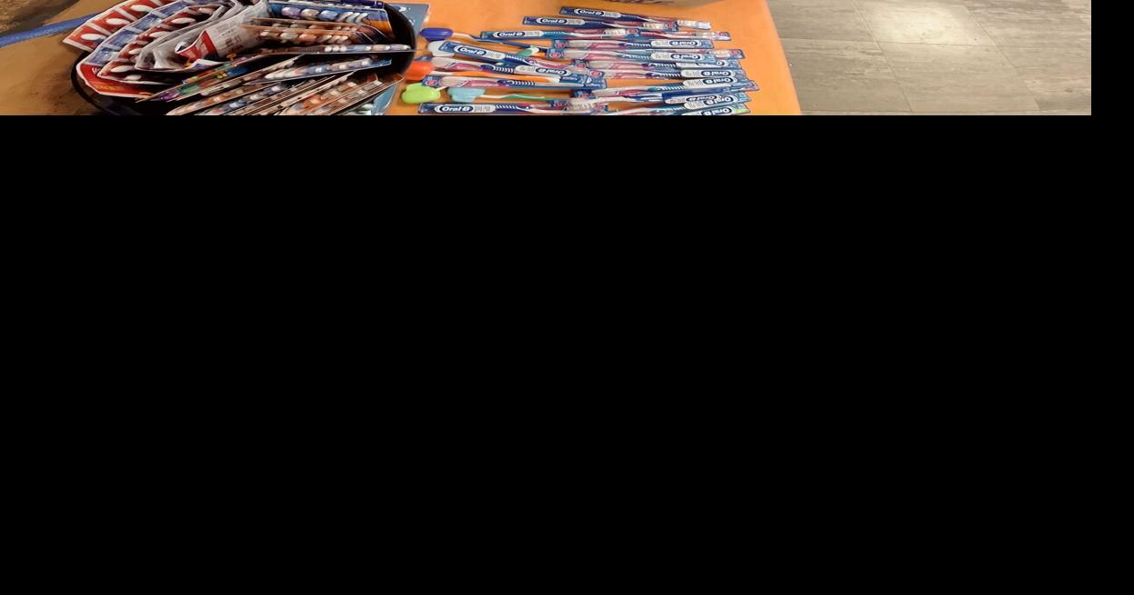 Sharon High Interact student prepare care packages