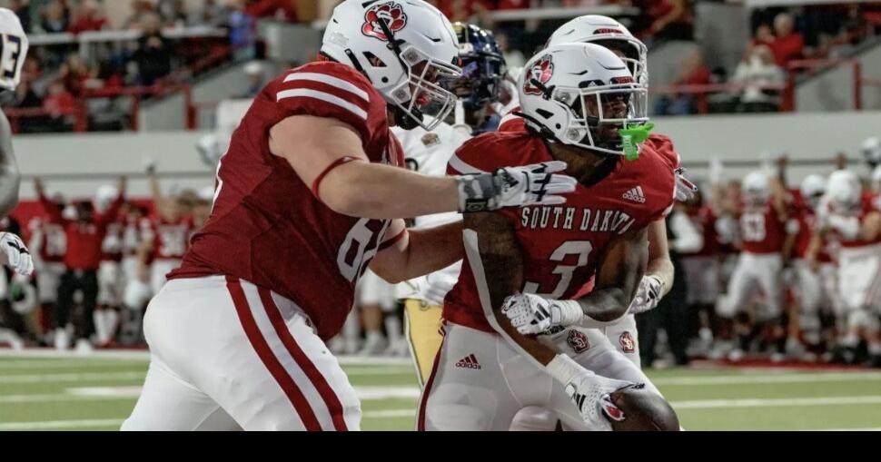Pierre runs for 153 yards, 2 TDs as South Dakota gets first road win