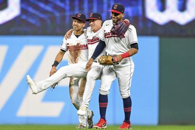 Cleveland Guardians' Josh Naylor, left, and Steven Kwan celebrate