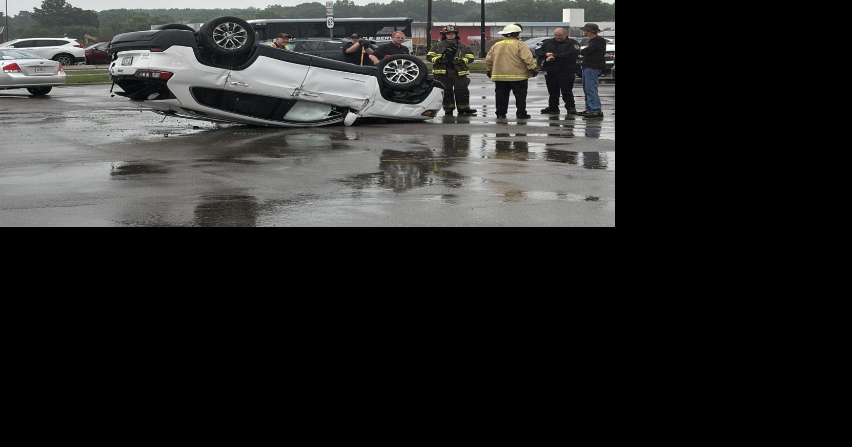Car ends up on roof in bank parking lot