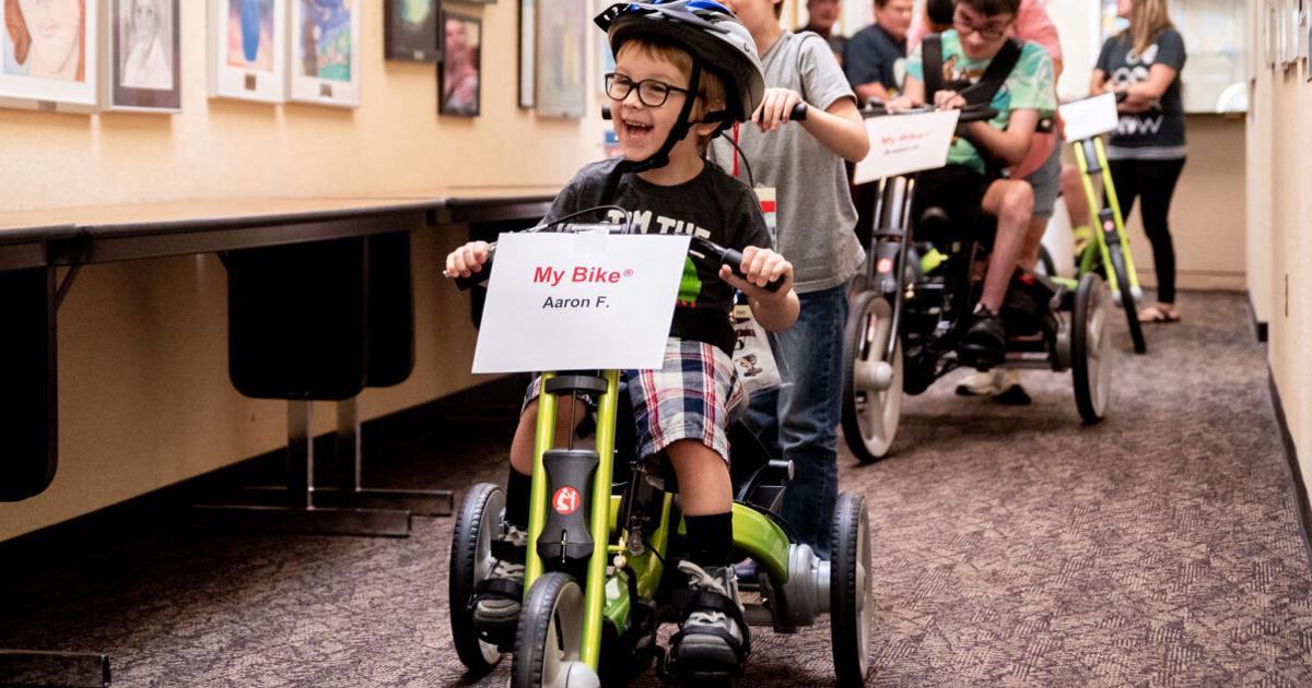 Child Getting Adapted 'We want to bring these kids joy'; Charity gives adaptive bikes to ...