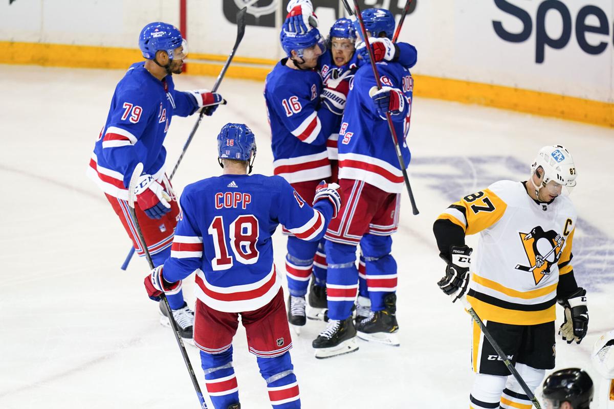 Penguins' Rickard Rakell injured by high hit from Rangers' Ryan