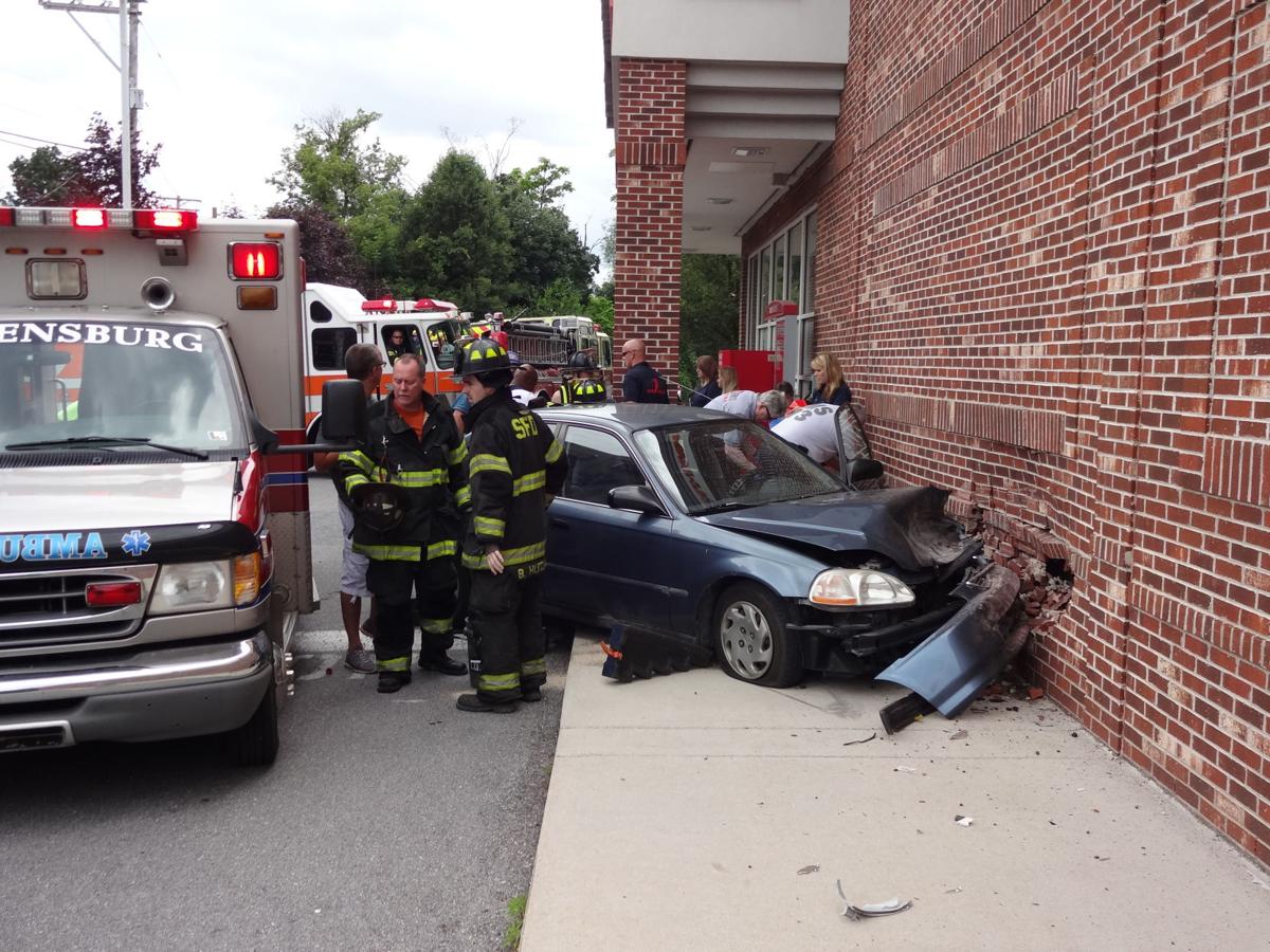 car crashes into cvs pharmacy police