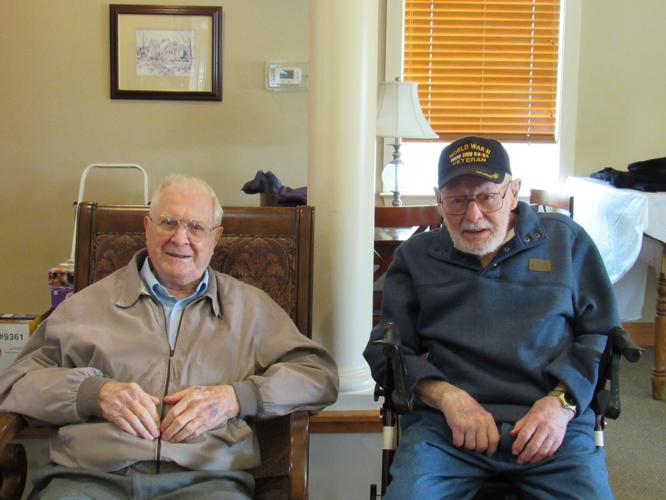 Land of the free WWII Veterans Richard Smith, Edgar Huffner raise the