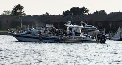 Police boat towing boat fire