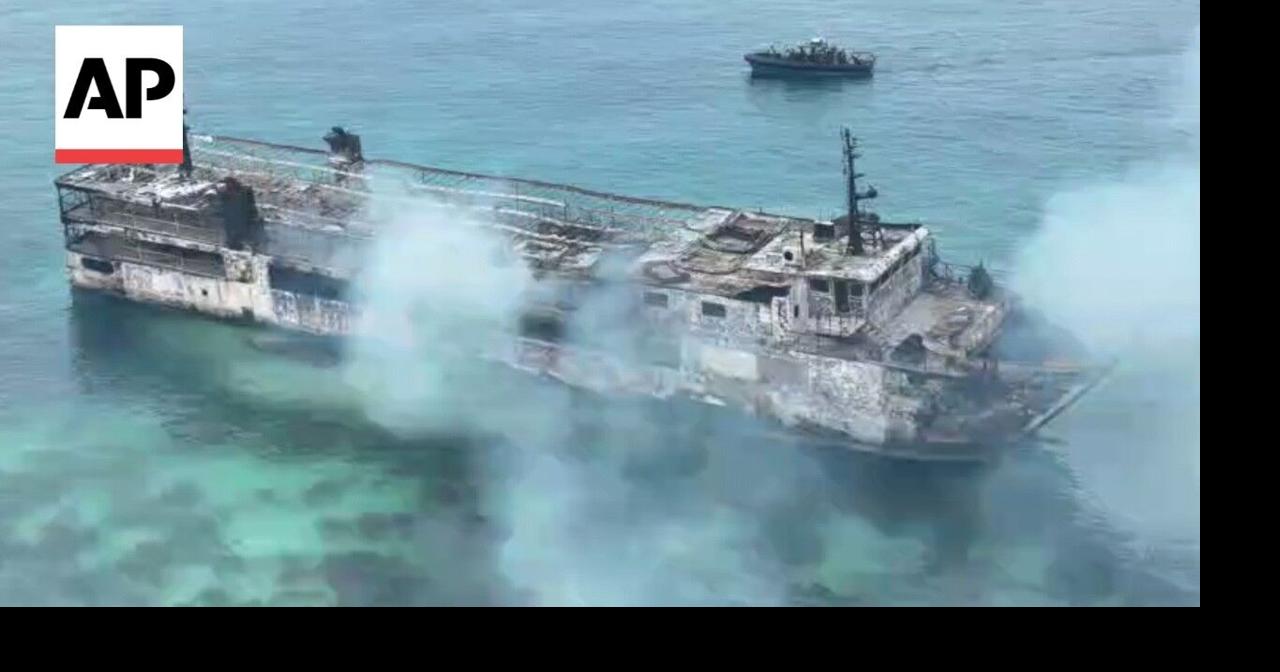 Smoldering remains of Philippine ferry after fire kills 5 with dozens missing