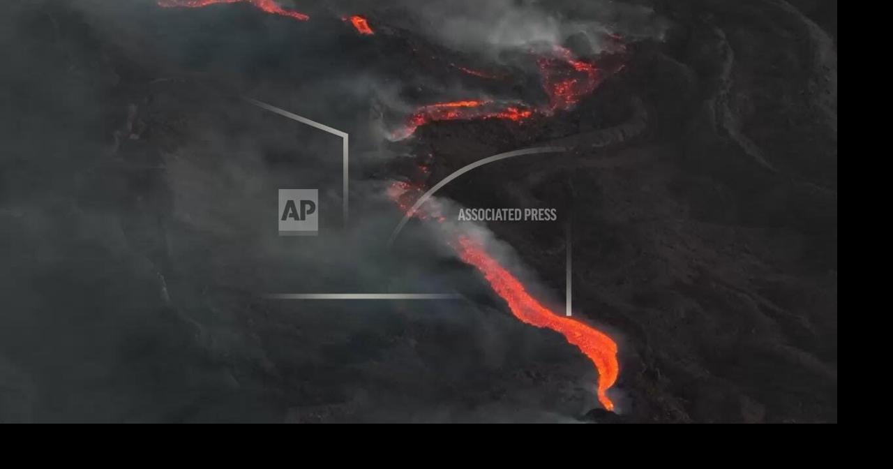 Mountain rescue police monitor guides and tourists drawn by Etna's night time lava flows
