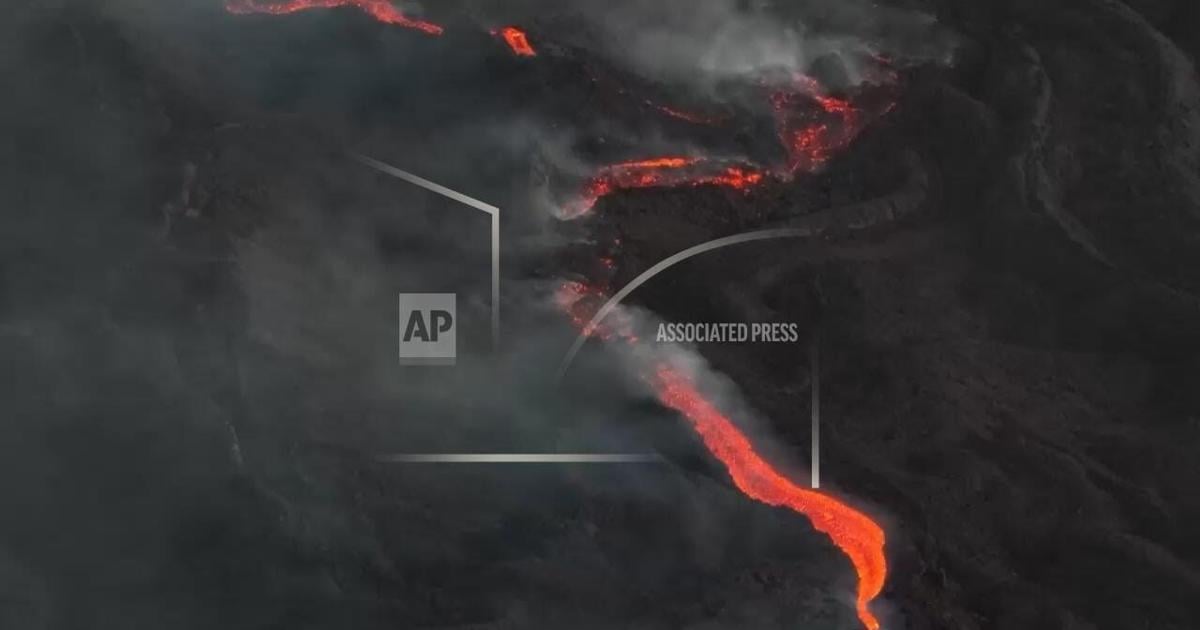 Mountain rescue police monitor guides and tourists drawn by Etna's night time lava flows