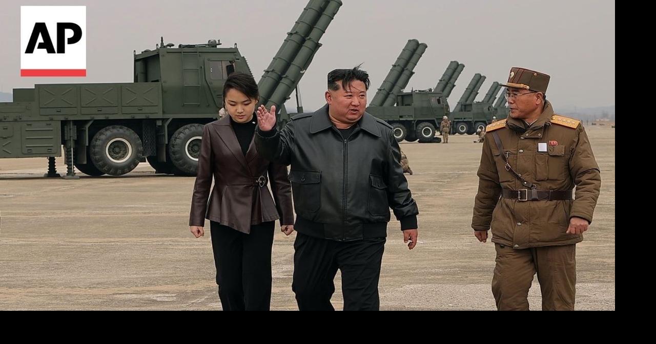 North Korea's Kim Jong Un observes rocket launch systems test with daughter