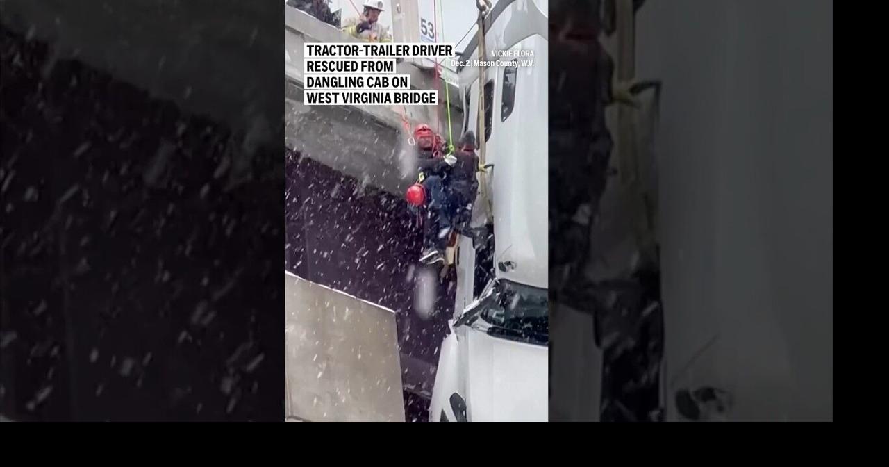 Tractor-trailer driver rescued from dangling cab on West Virginia bridge