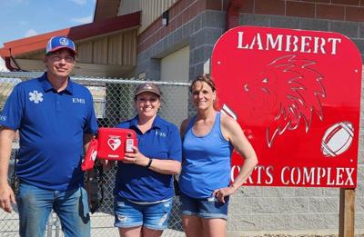 Lambert Ambulance donates AED to Lambert Sports Complex