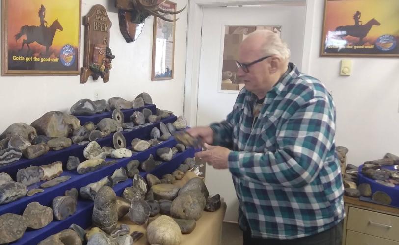 Tom Harmon inspects his collection of agates