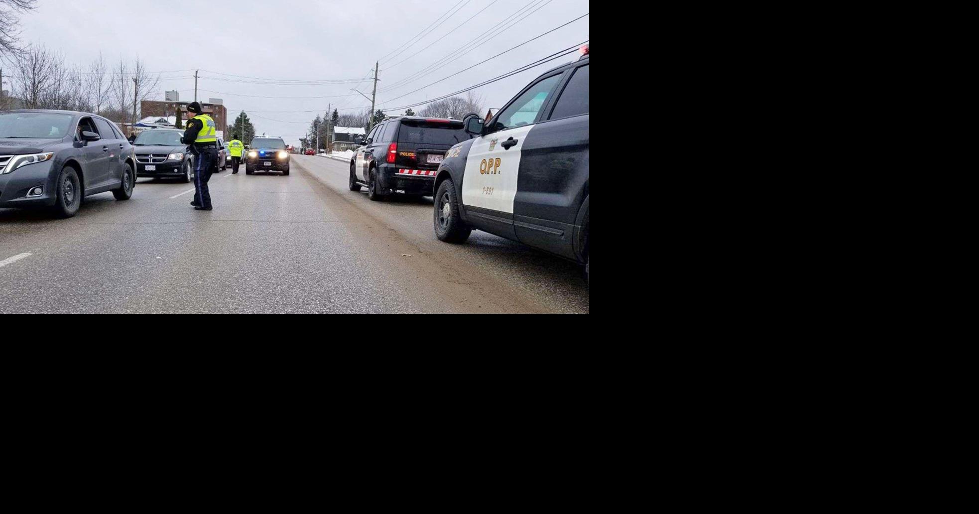 Woman charged after crashing into median in Midland