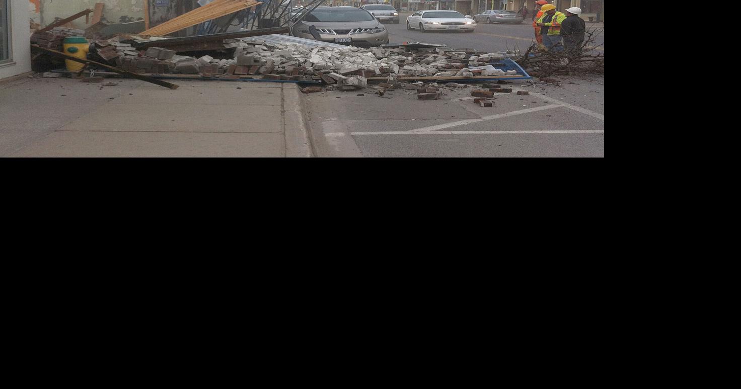 Building collapses onto sidewalk