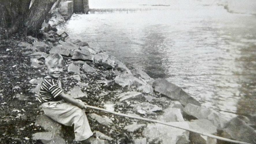 Larry Myhre fishing as a boy