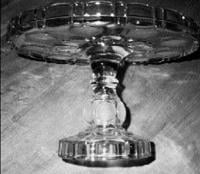'Coin glass' has value on antique cake plate 