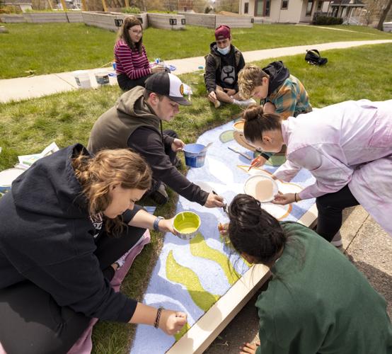 Morningside students paint stormwater drain murals