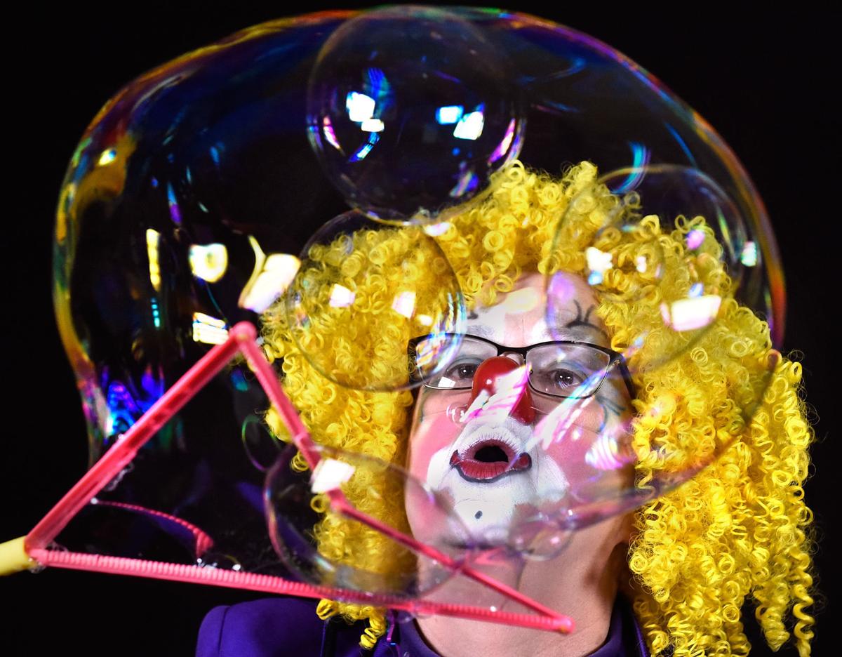 Northwest Iowa clown's bubble blowing puts smiles on faces