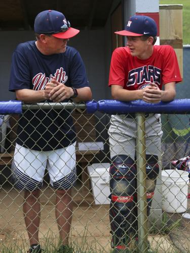 Covering their bases: Sioux City North High baseball players keep cool  during severe heat