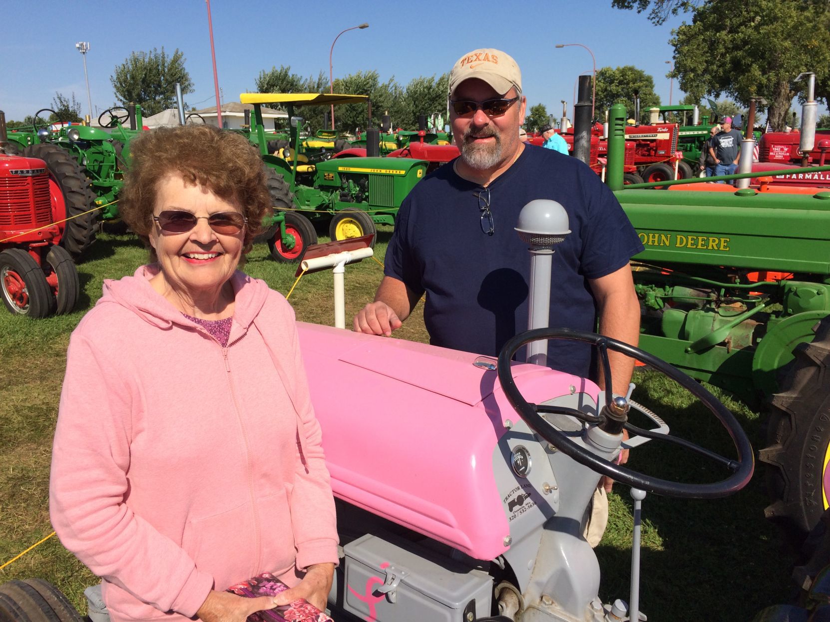 Pink john deere on sale tractor ride on