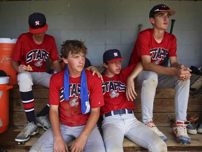 Covering their bases: Sioux City North High baseball players keep cool  during severe heat