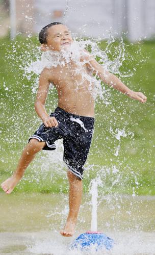 cooling down at the splash pad in hot weather