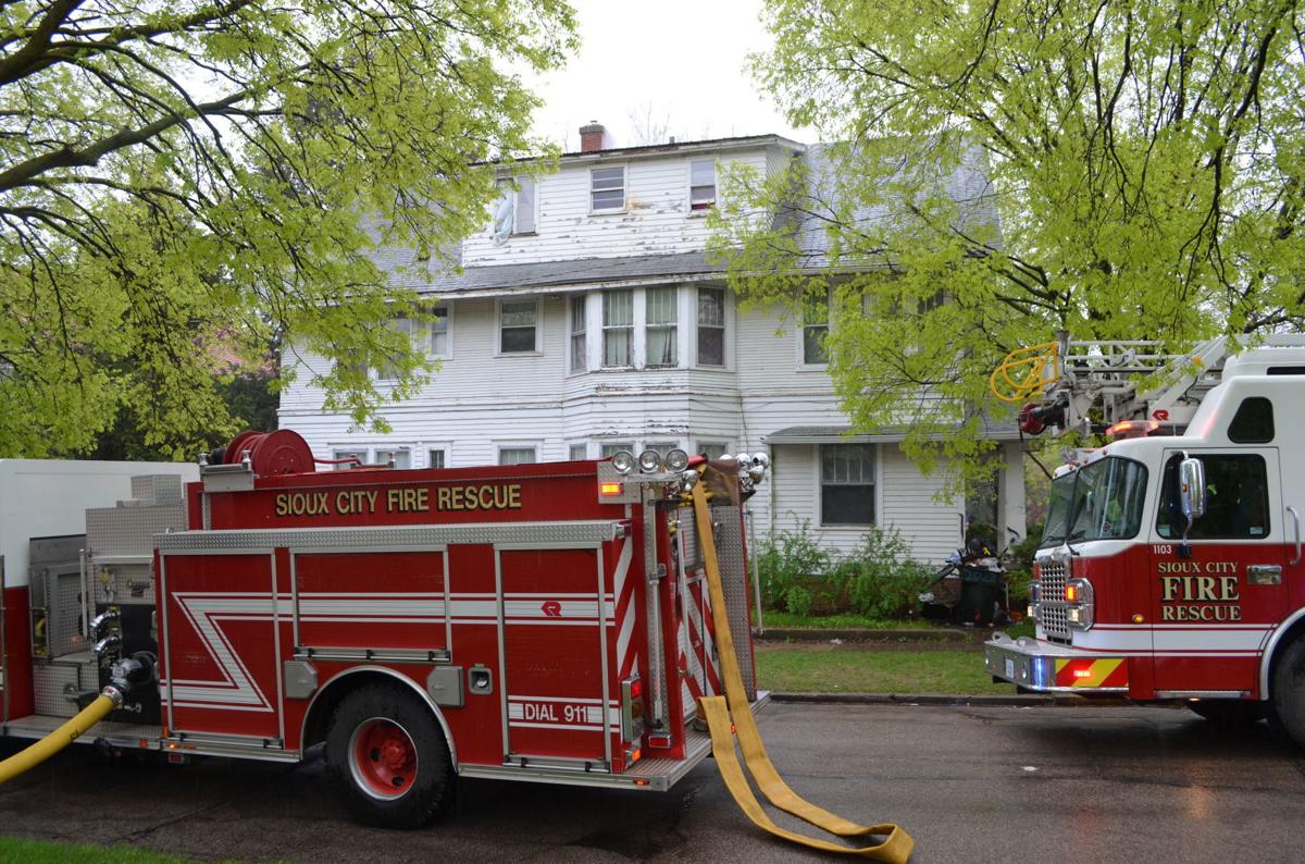 Sioux City fire crews battle attic fire at corner of Jackson and 21st