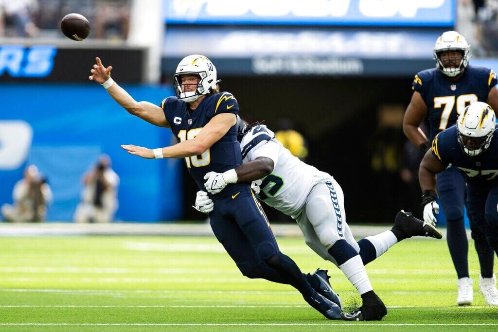 FILE - Chicago Bears defensive end Robert Quinn (94) rushes during