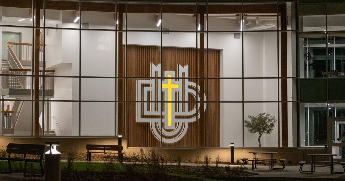 Dordt atrium has glowing logo crafted by student, father