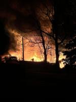 Fire engulfs structure and vehicles in Stewartsville