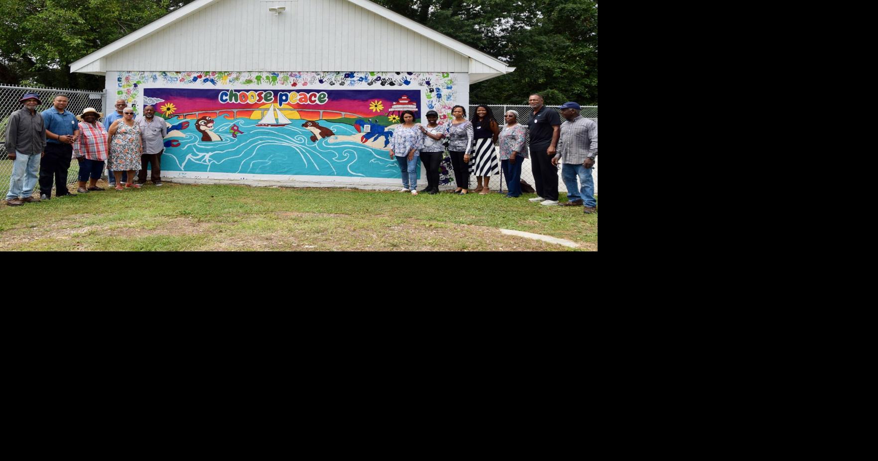 Youth center unveils mural; reopens pool for youth programs in Calvert ...