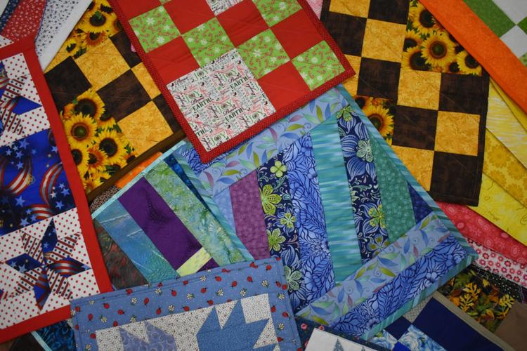Quilting guild minds its P's (placemats) and Q's (quilts) Spotlight