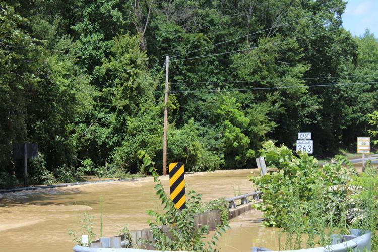 Downed trees, flooded roads and disappearing bridges in Calvert News