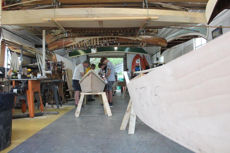 Boat builders camp launch round of canoes Arts and Entertainment