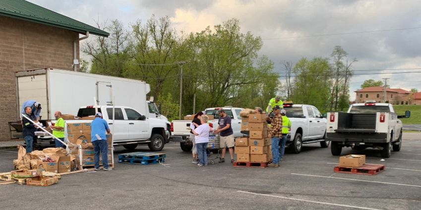 Staff Load Trucks Headed for Local Food Banks