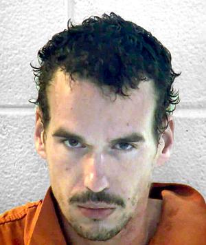 Fleeing suspect jumps into creek
