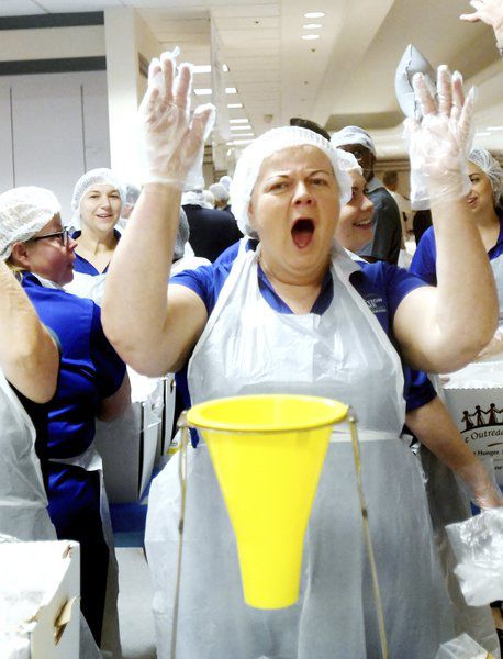 Hundreds pack more than 200,000 meals for those in need