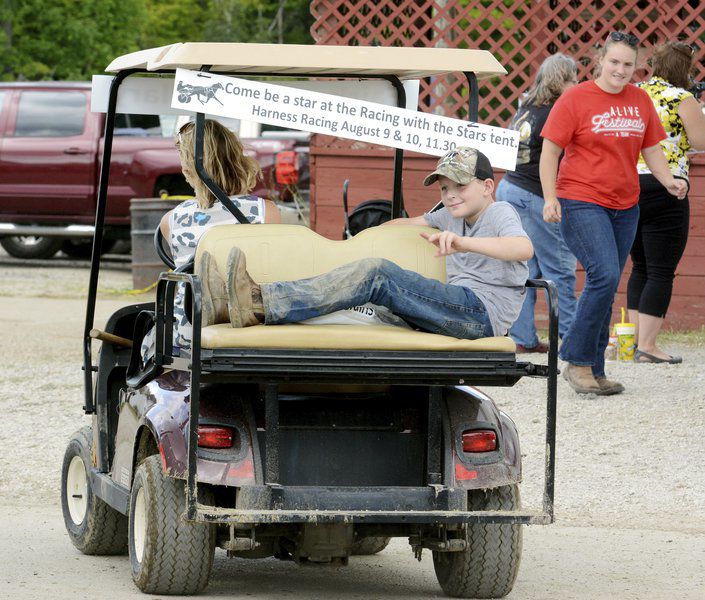 Rooster crowing, harness racing, monster trucks and sunny skies draw crowds to Day 3 of Ashtabula County Fair