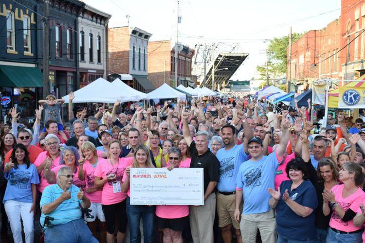 Wine and Walleye Festival crowd celebrates 25,000 check Local News