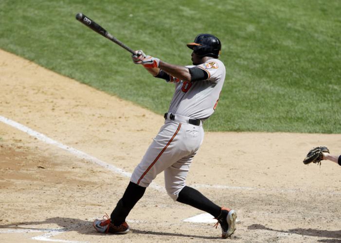 Baltimore Orioles' J.J. Hardy (2) and Adam Jones greet Jim Thome