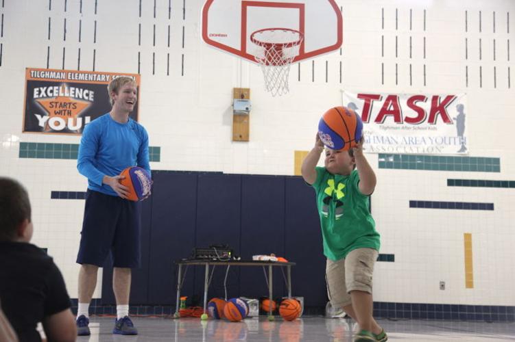 Tilghman Elementary gets a lesson in basketball and character Photos