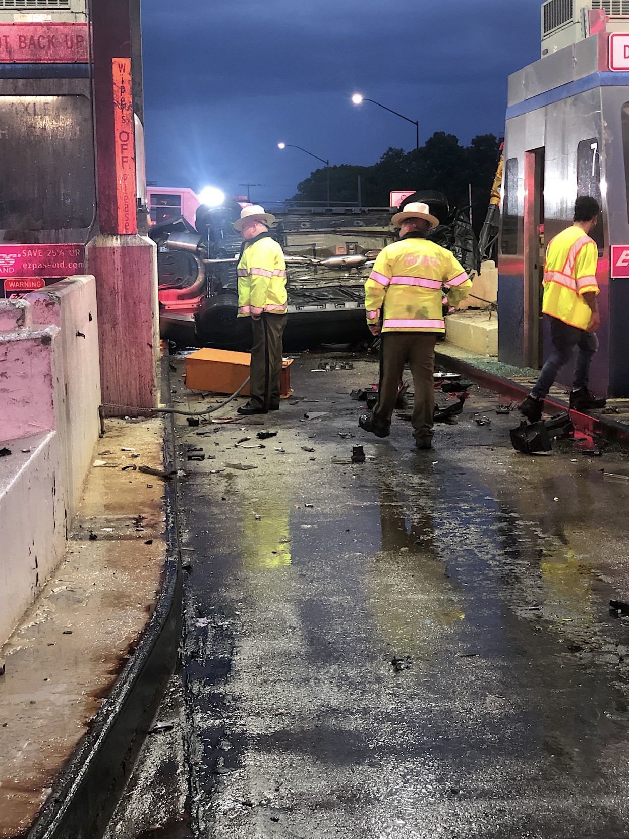 Vehicle rollover closes three lanes at toll plaza Spotlight