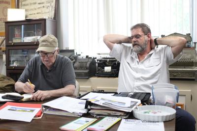Bill Schaffner (left) and Robert Mosher talking about new location.