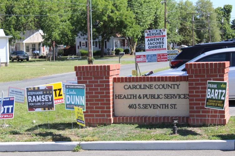 Caroline County early voting location Health and Public Services Building with campaign and voting signs outside of the building.